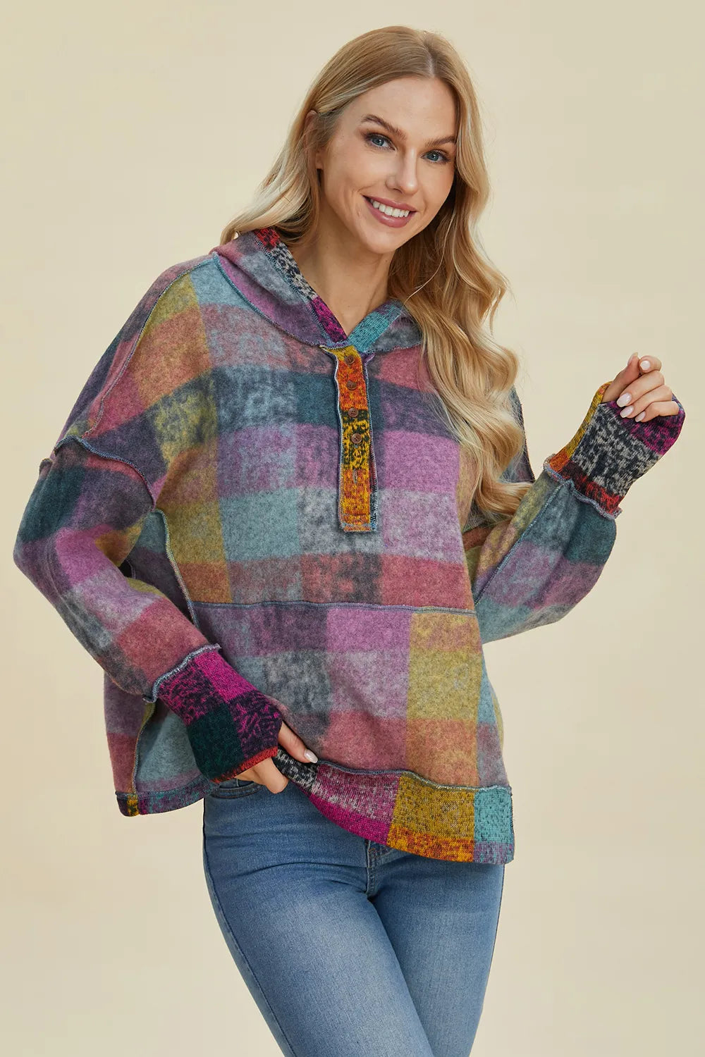 Multicolor plaid fleece hoodie with half-zip placket and dropped shoulders, front view