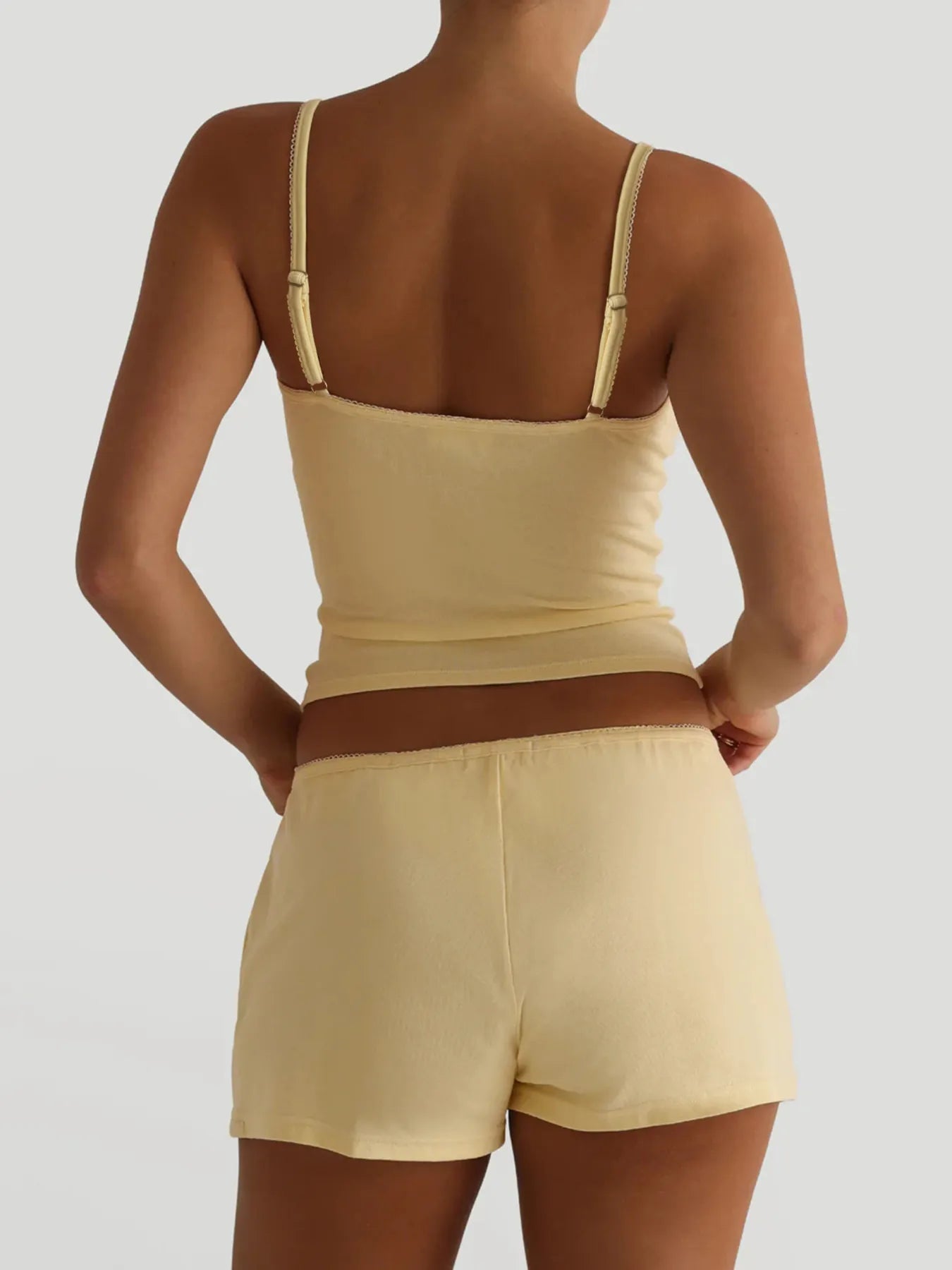 Light yellow cami with thin straps and matching shorts, sleeveless set