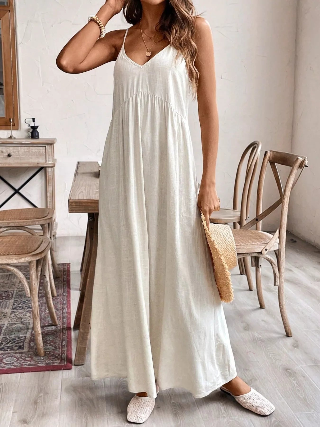Cream spaghetti strap maxi dress with V-neck, loose skirt, side drape