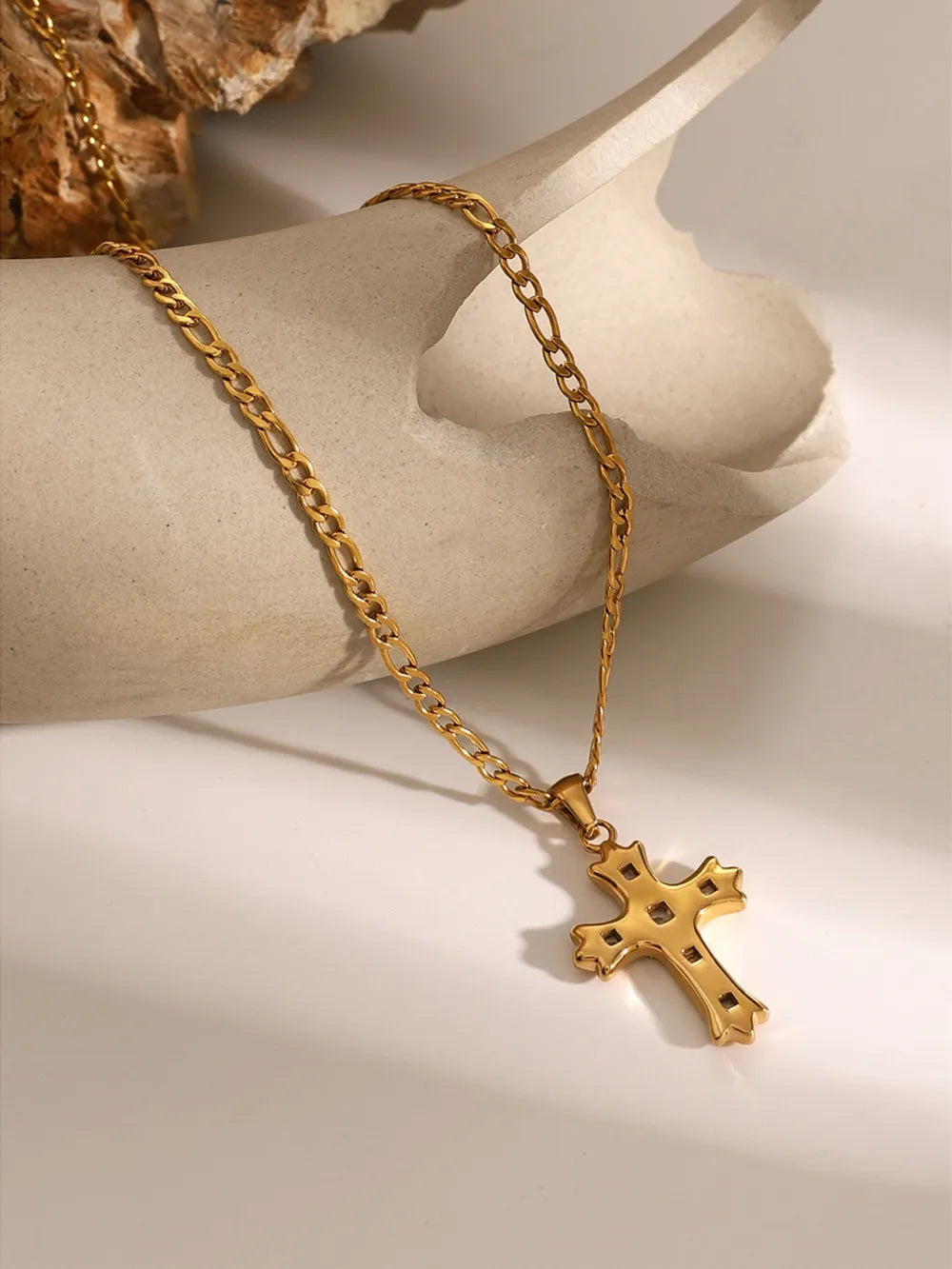 Gold-tone cross pendant necklace with smooth cross face