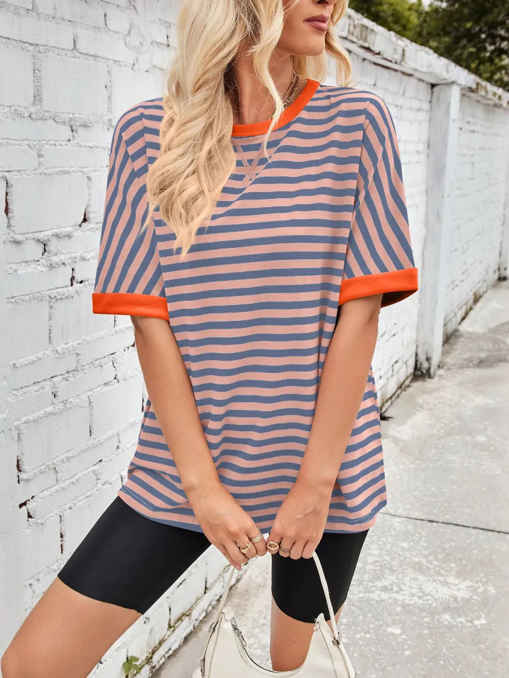 Striped round-neck half-sleeve T-shirt in blue with orange trim and curved hem