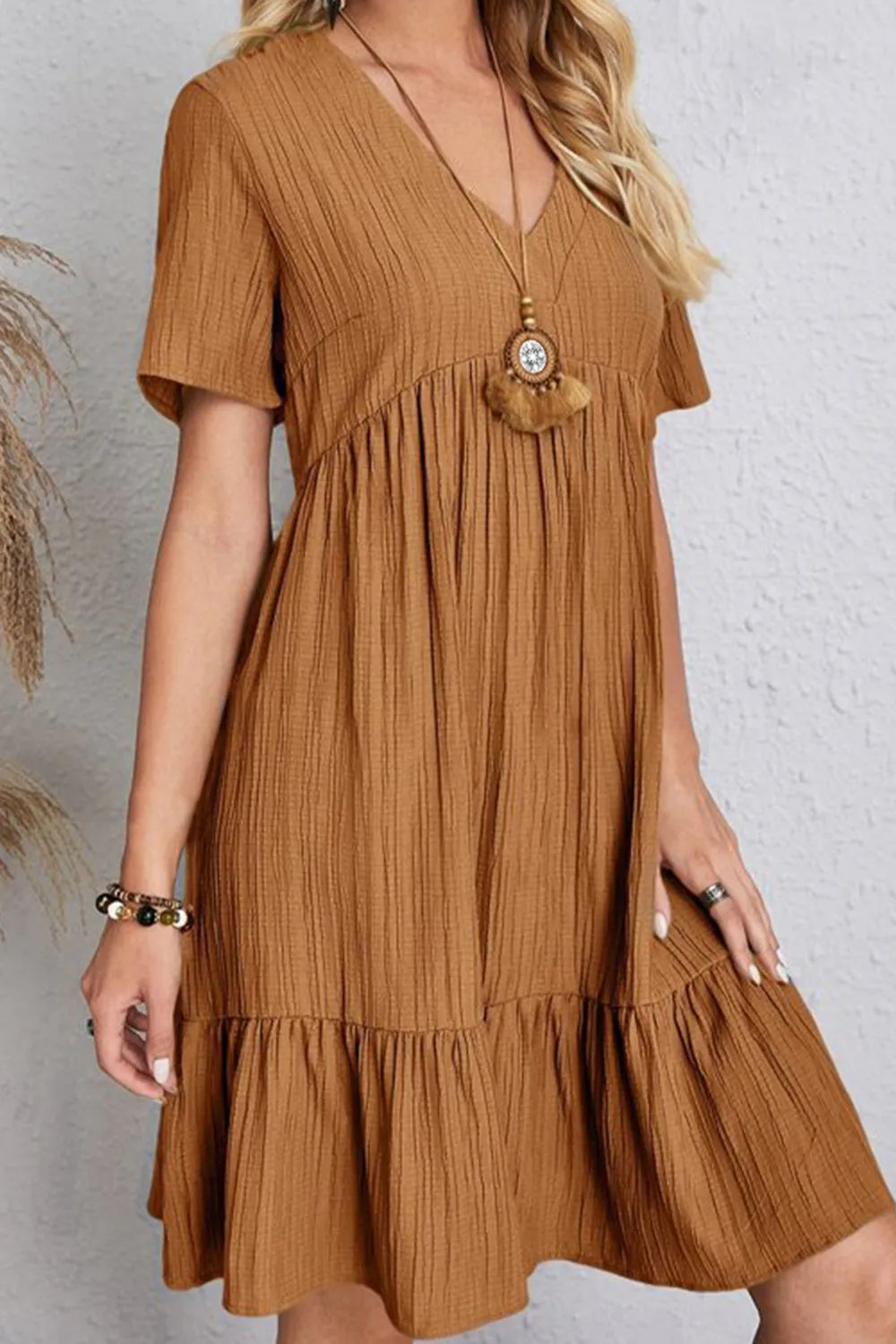 Caramel V-neck short-sleeve dress with gathered bodice and ruffled tiered skirt