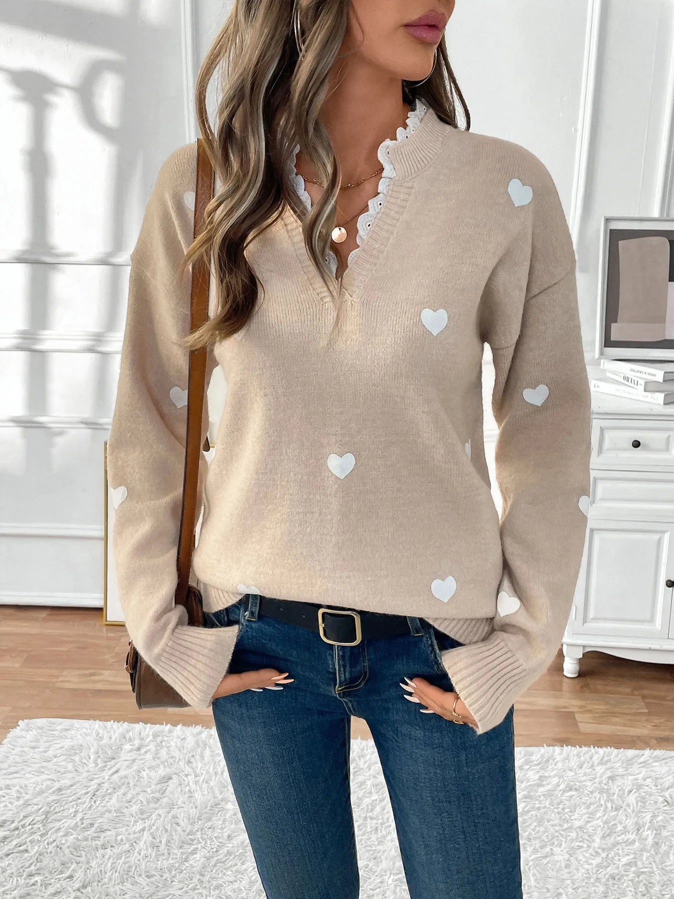 Light khaki v-neck long sleeve knit sweater with scattered white heart print