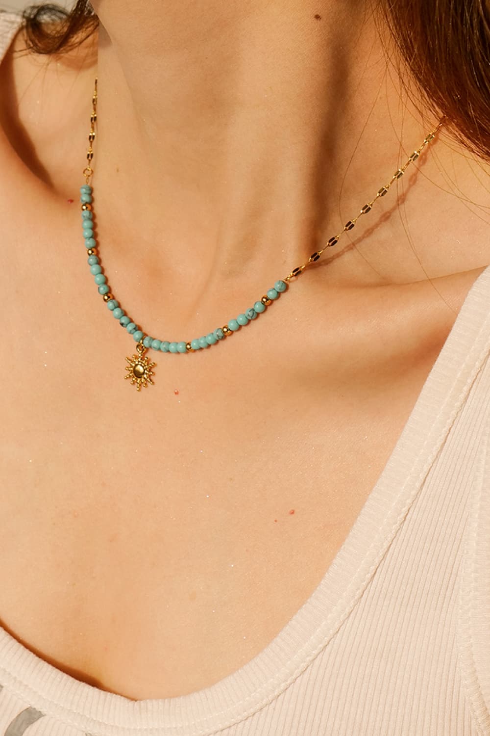 Turquoise beaded gold necklace with small sun pendant charm
