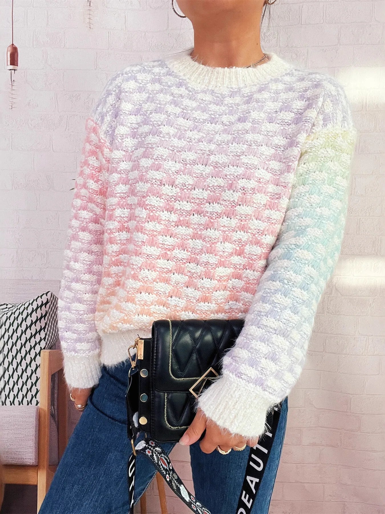 Rainbow gradient knit sweater with crew neck, long sleeves, ribbed cuffs and hem