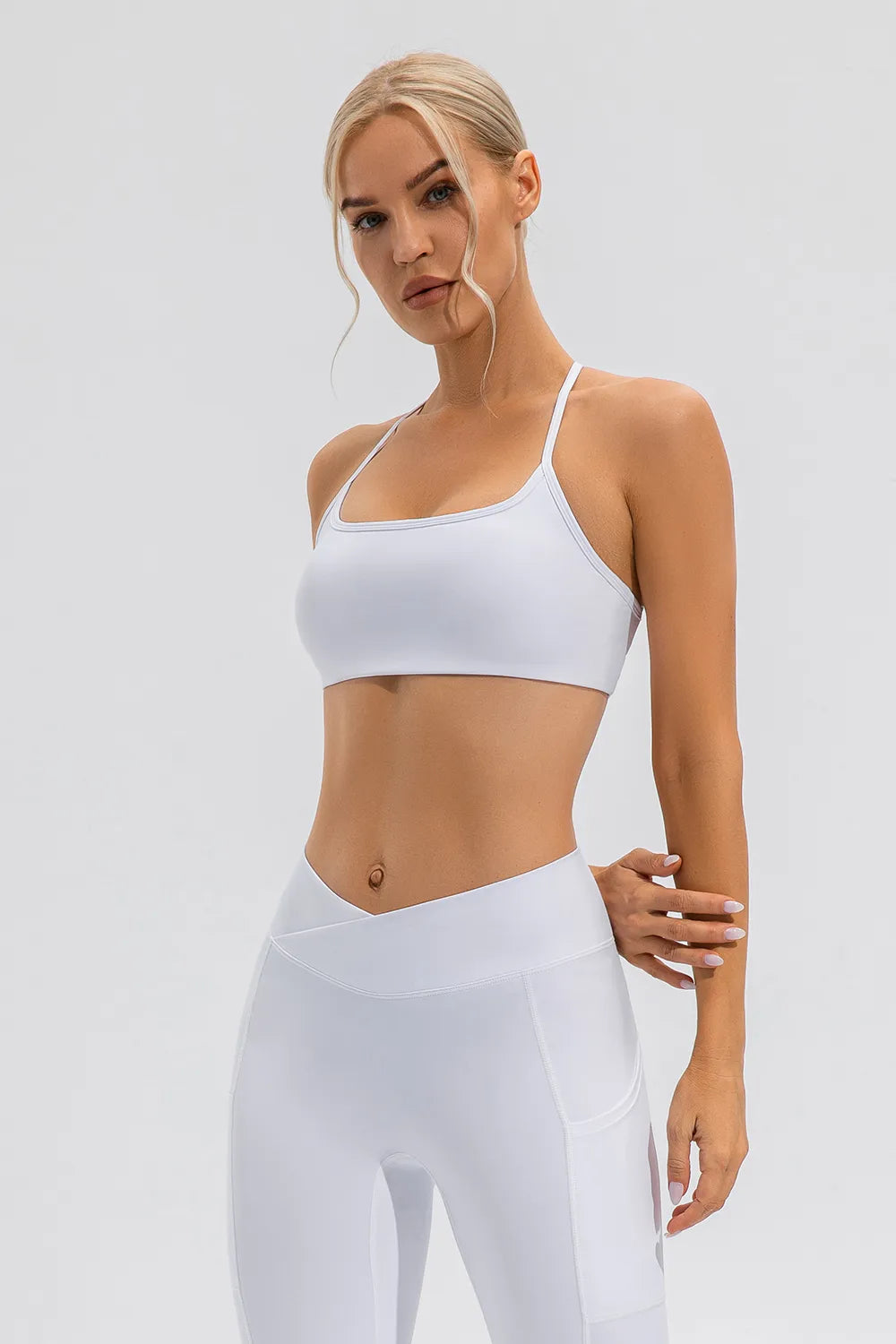 White active spaghetti strap cami with supportive square neckline and cropped fit