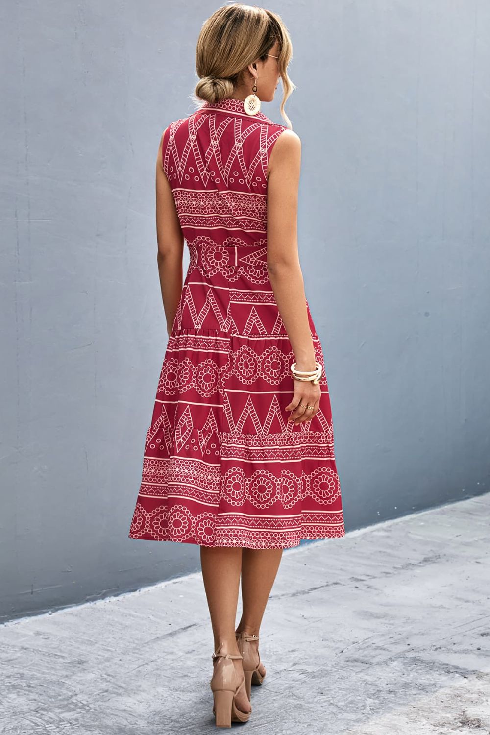 Deep red printed sleeveless collared dress, back view with tie waist