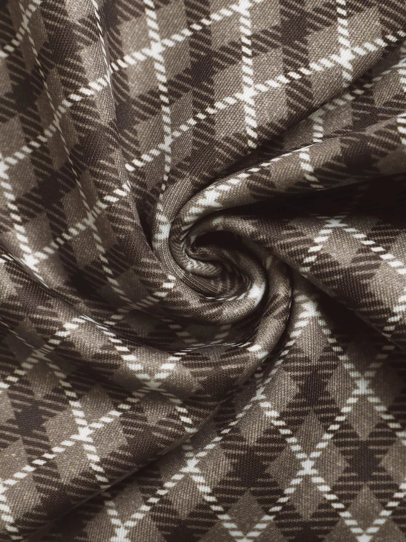 Brown plaid fabric close-up with diamond check pattern texture