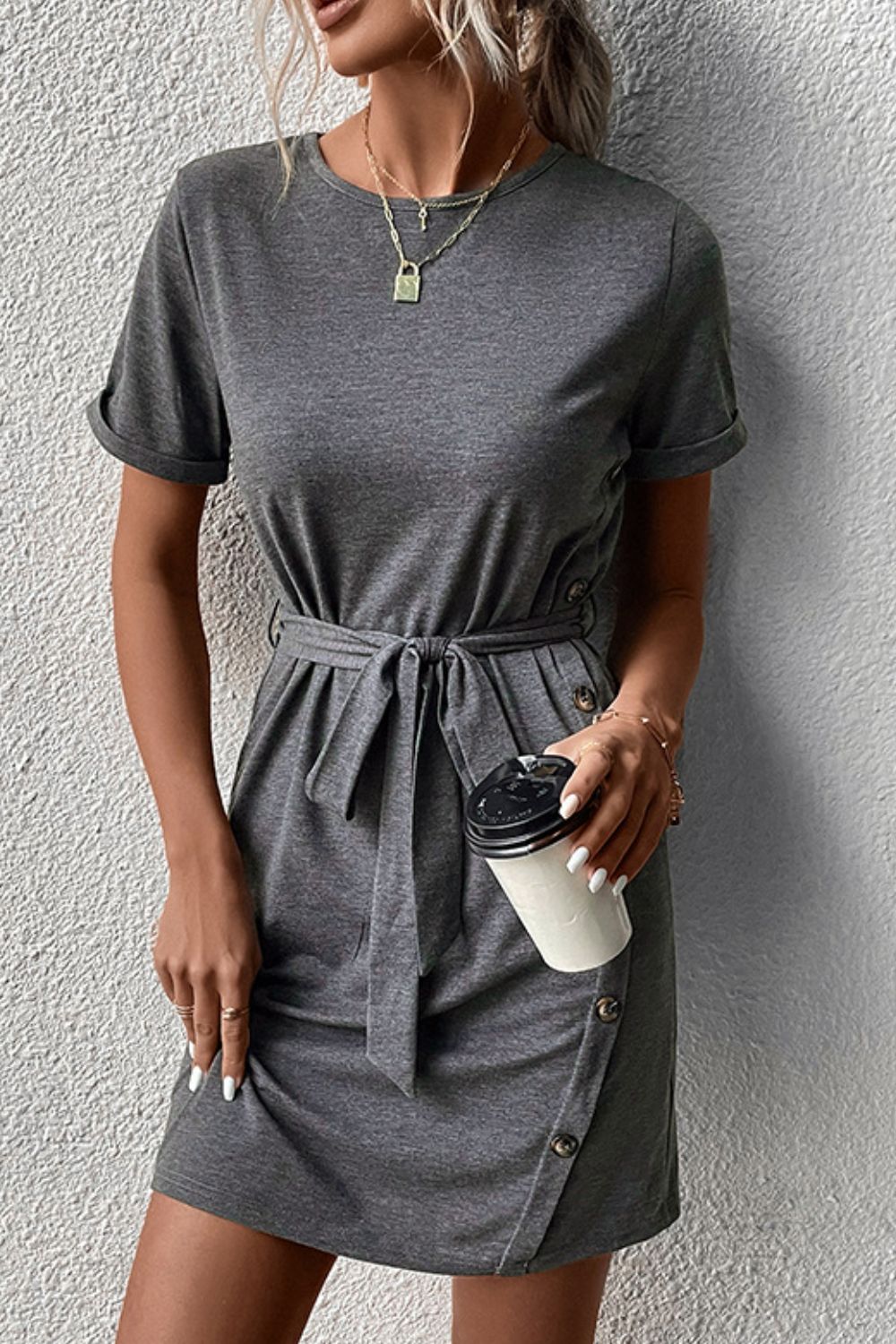 Dark gray tee dress with tie waist and cuffed sleeves, decorative button placket