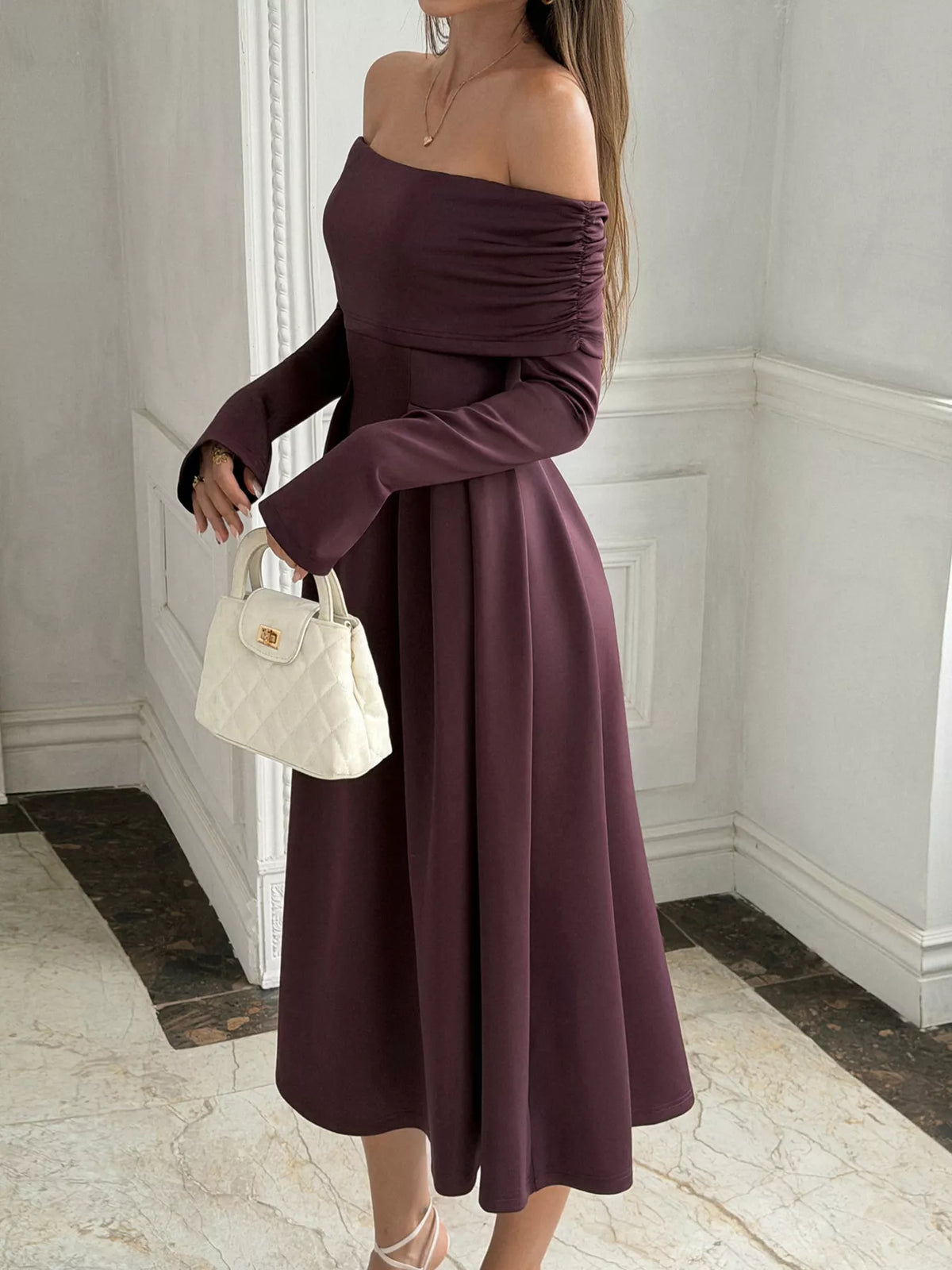 Burgundy off-shoulder midi dress with ruched bodice, long sleeves, and A-line silhouette