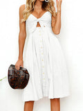 White cami dress with sweetheart neckline cutout and bow, button front, flared skirt