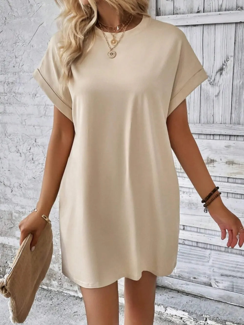 Cream round-neck short-sleeve dress, front view with gently curved hem