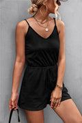 Black spaghetti strap V-neck romper with drawstring waist and cinched shorts