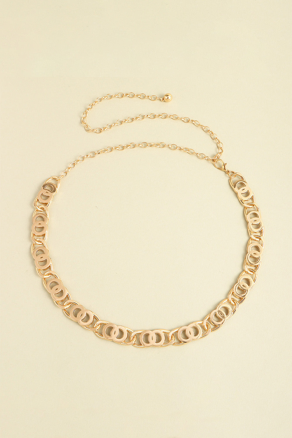 Gold lobster clasp belt with oval-link chain and decorative curved link border