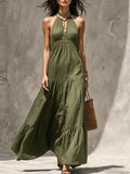 Army green halter tiered maxi dress with gathered bodice and layered skirt.