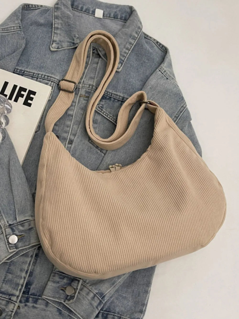 Khaki ribbed shoulder bag with adjustable strap and braided tassel pull