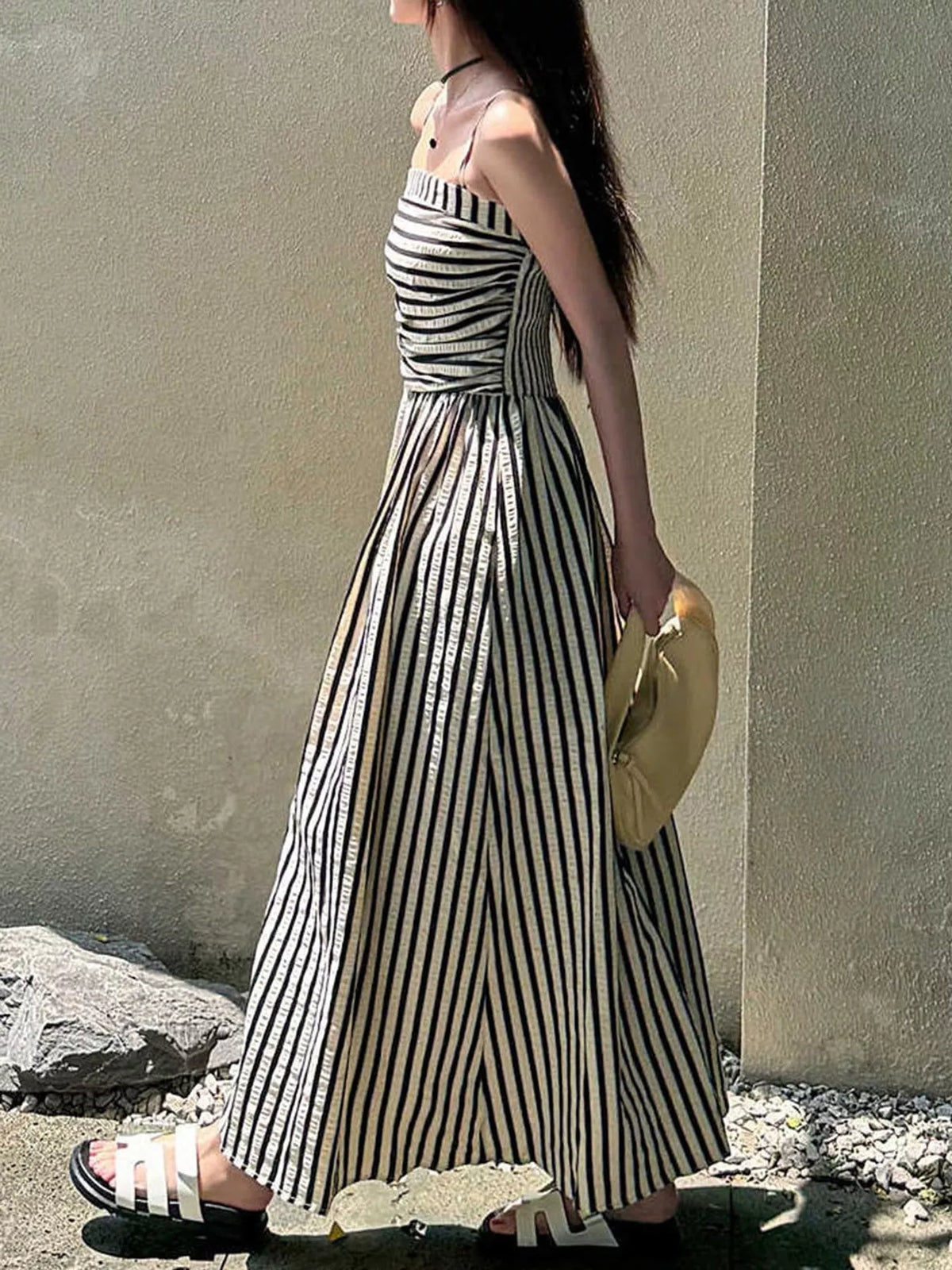 Ruched sleeveless blue-and-white striped maxi dress with thin spaghetti straps