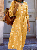 Yellow notched neck dress with white geometric diamond print, 3/4 sleeves, gathered waist