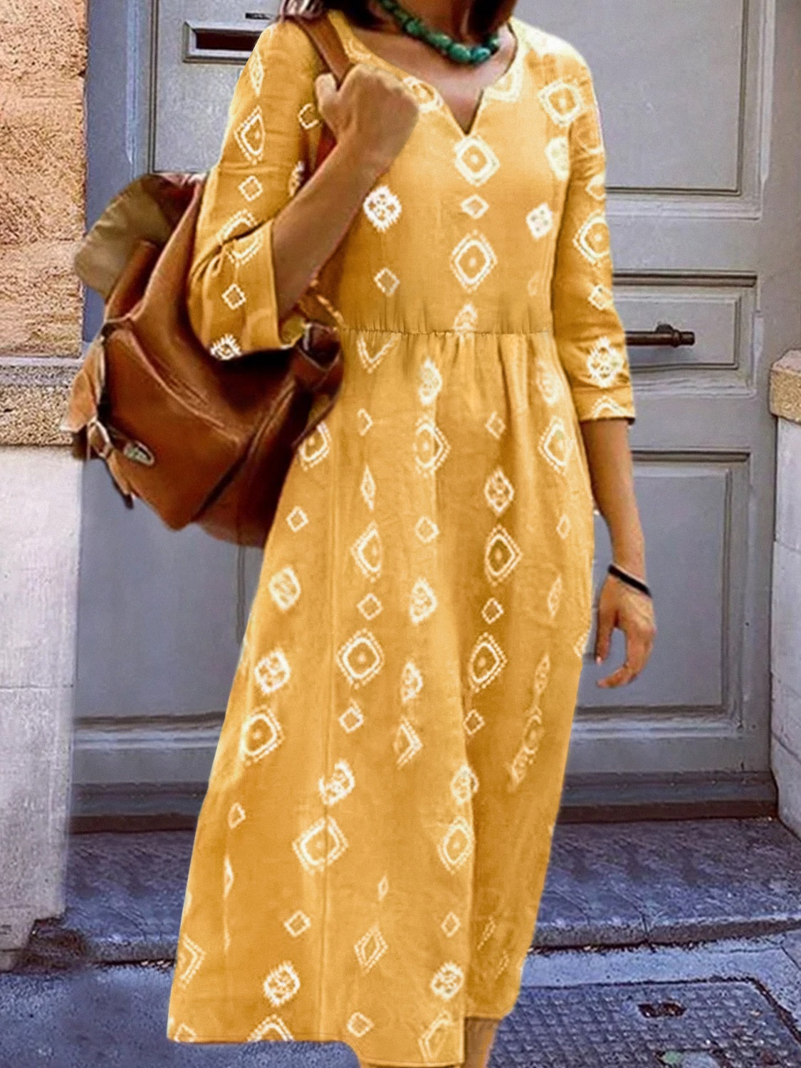 Yellow notched neck dress with white geometric diamond print, 3/4 sleeves, gathered waist