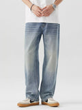 Blue vintage-wash loose-fit cotton jeans, front view with belt loops and fly