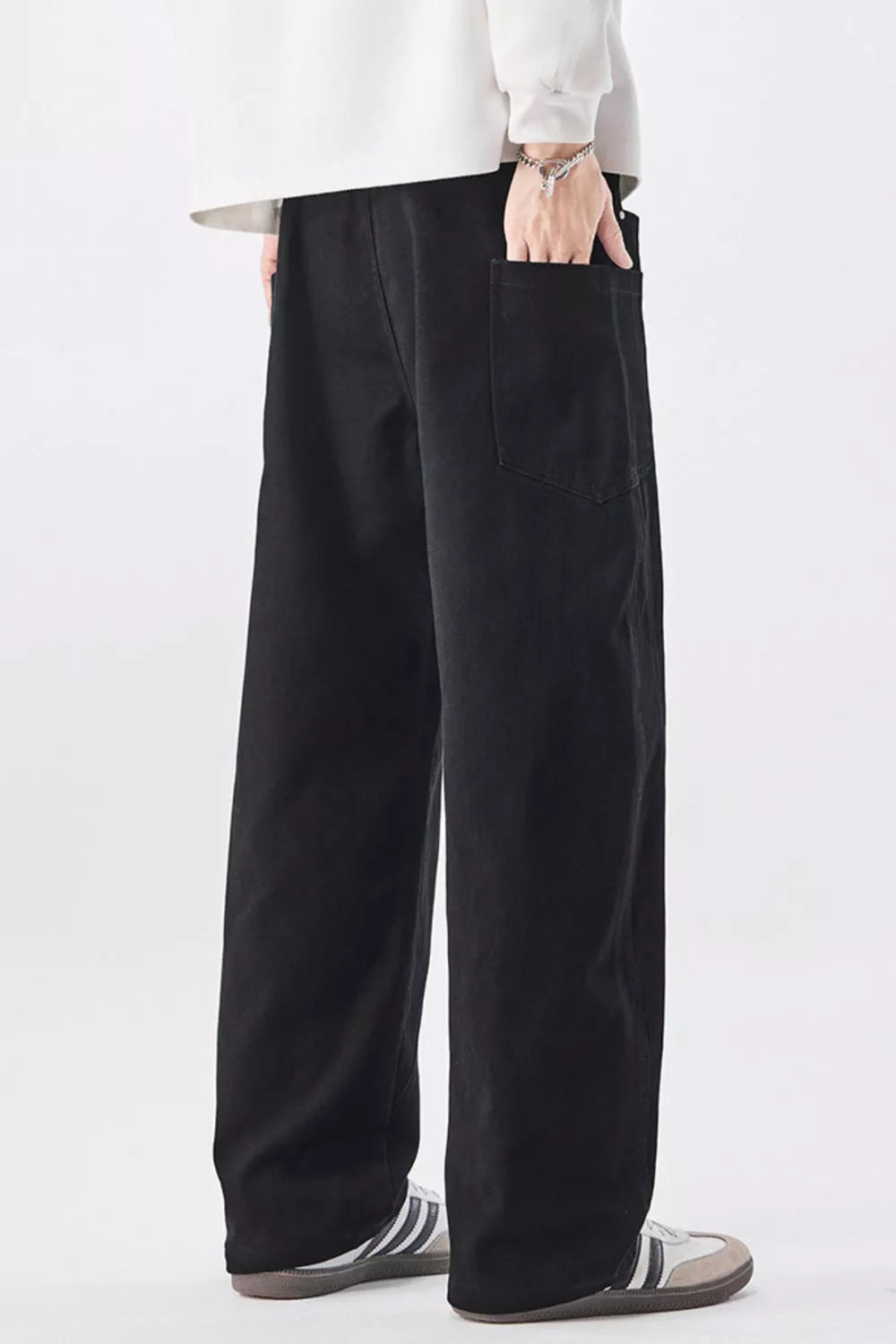 Men's black cotton drawstring jeans with wide-leg relaxed silhouette