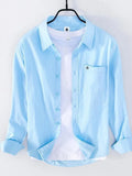 Light blue long sleeve button-up shirt with chest pocket and button placket