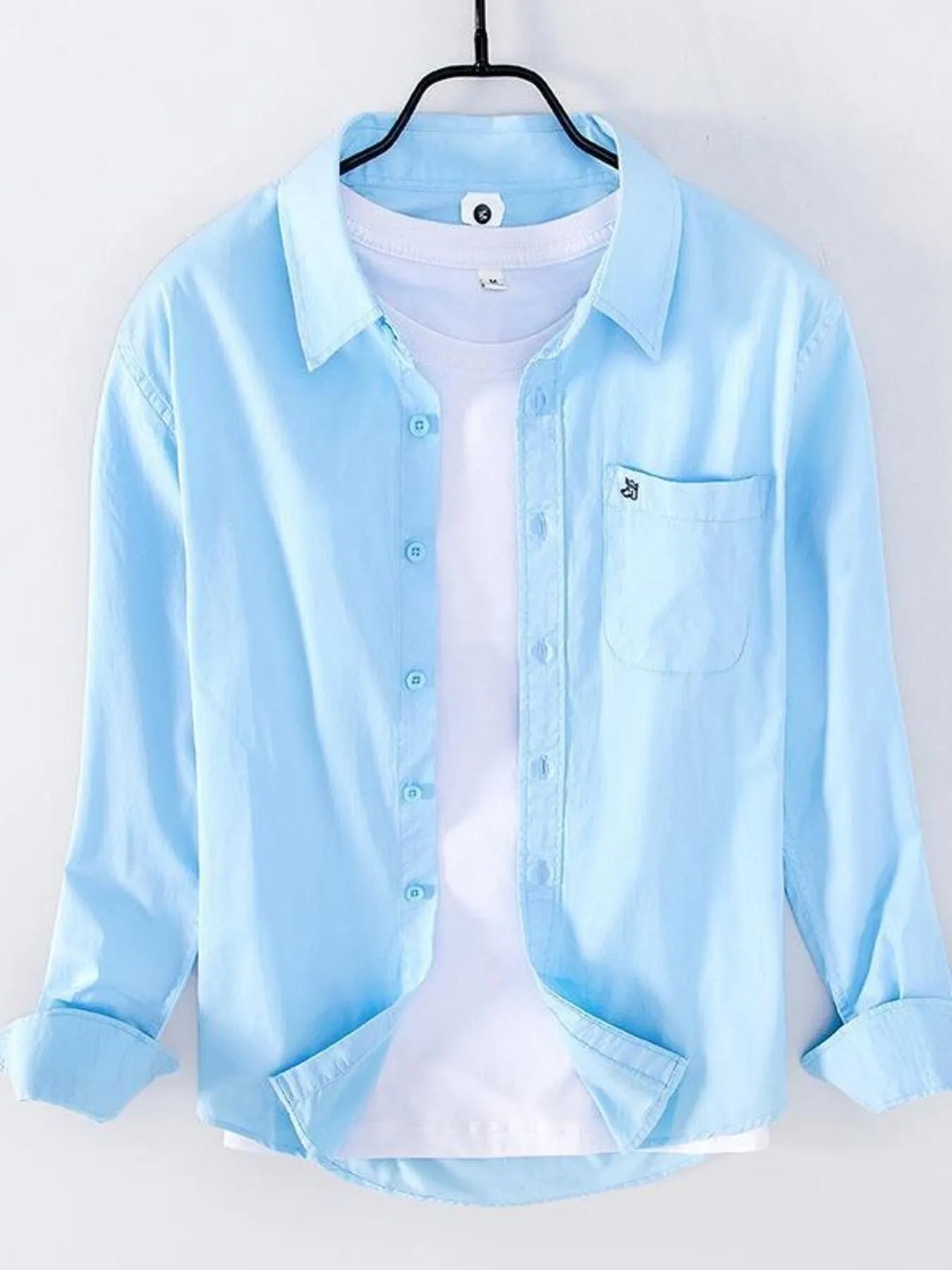 Light blue long sleeve button-up shirt with chest pocket and button placket