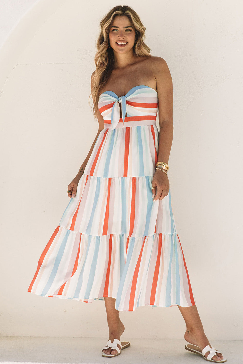 Multicolor striped strapless sweetheart dress with tiered skirt and bow front
