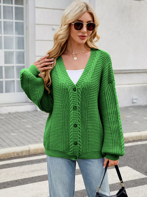 Green button-up long-sleeve cardigan with V-neck and ribbed knit texture.