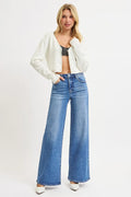 Medium wash high-rise wide-leg jeans worn with a cropped striped top
