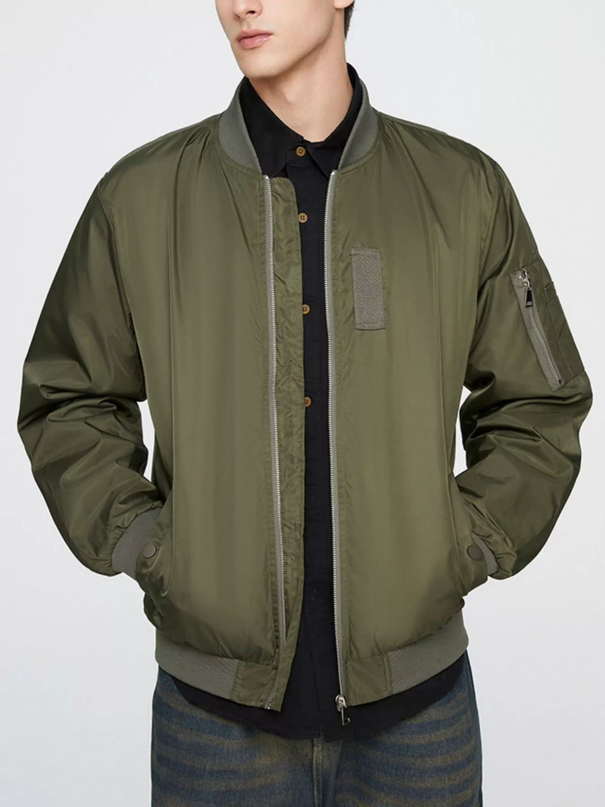 Army green lightweight bomber jacket with front zip, ribbed trim, and chest utility pocket