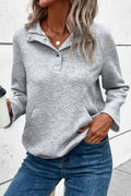 Light gray snap-button long-sleeve sweatshirt with geometric chevron pattern