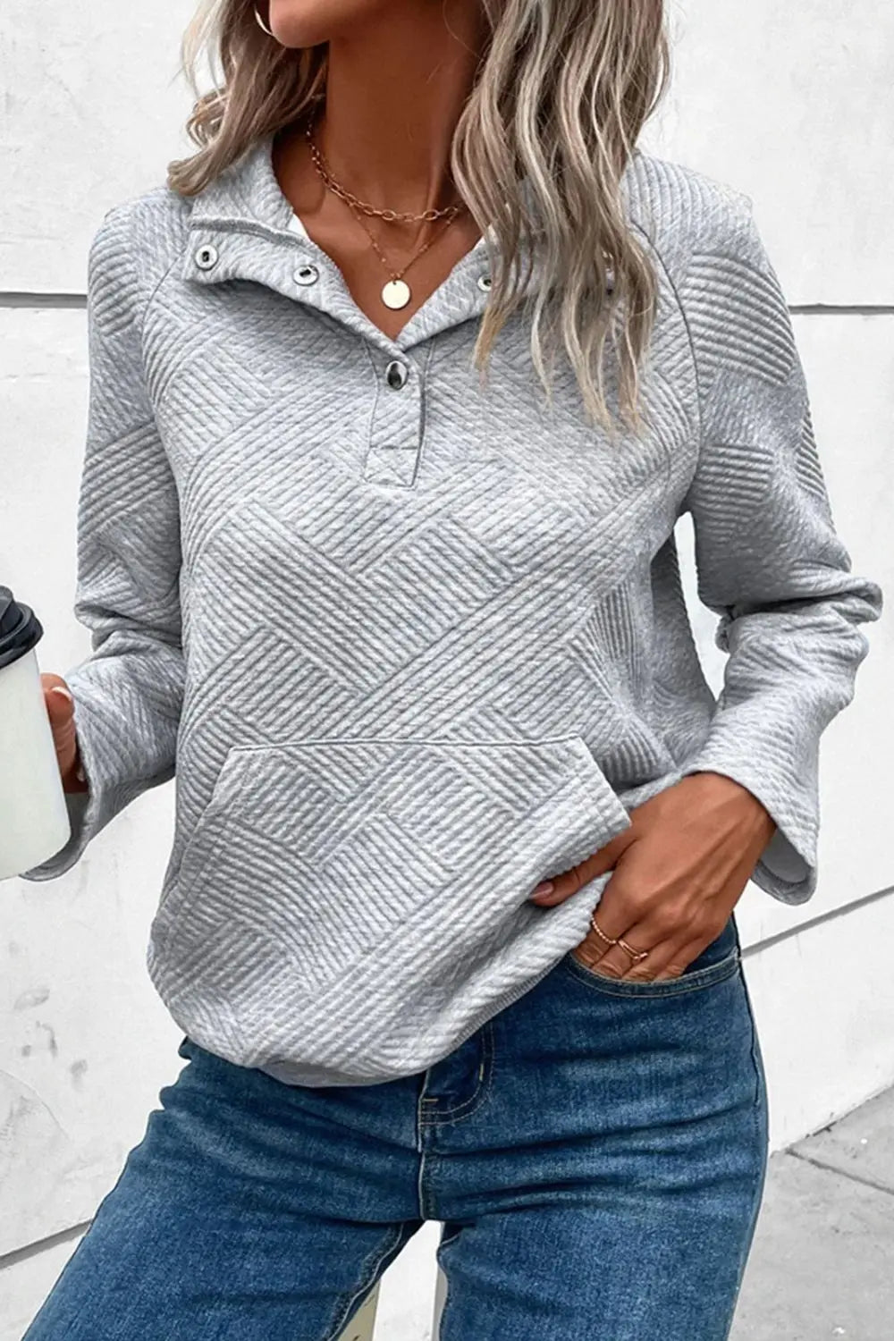 Light gray snap-button long-sleeve sweatshirt with geometric chevron pattern
