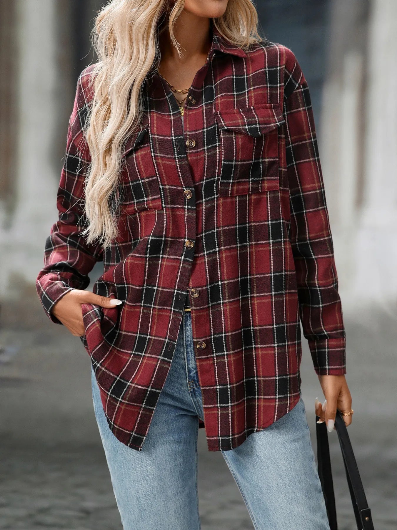 Plaid button-down oversized shirt in dark red with black and white lines, chest pockets.