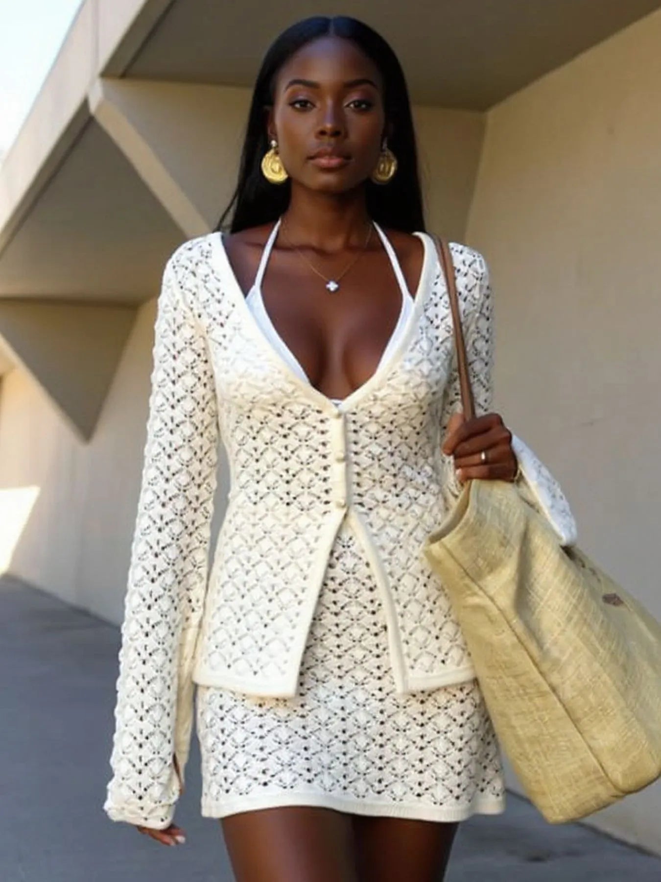 Cream crochet button-up cardigan and matching mini skirt set, open V-neck design