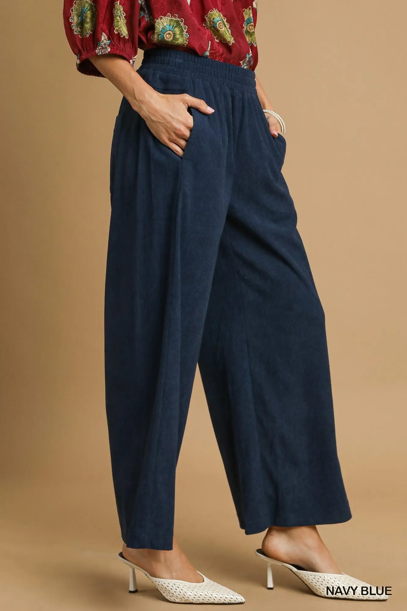 Navy blue corduroy wide-leg pants, side pockets and straight drape