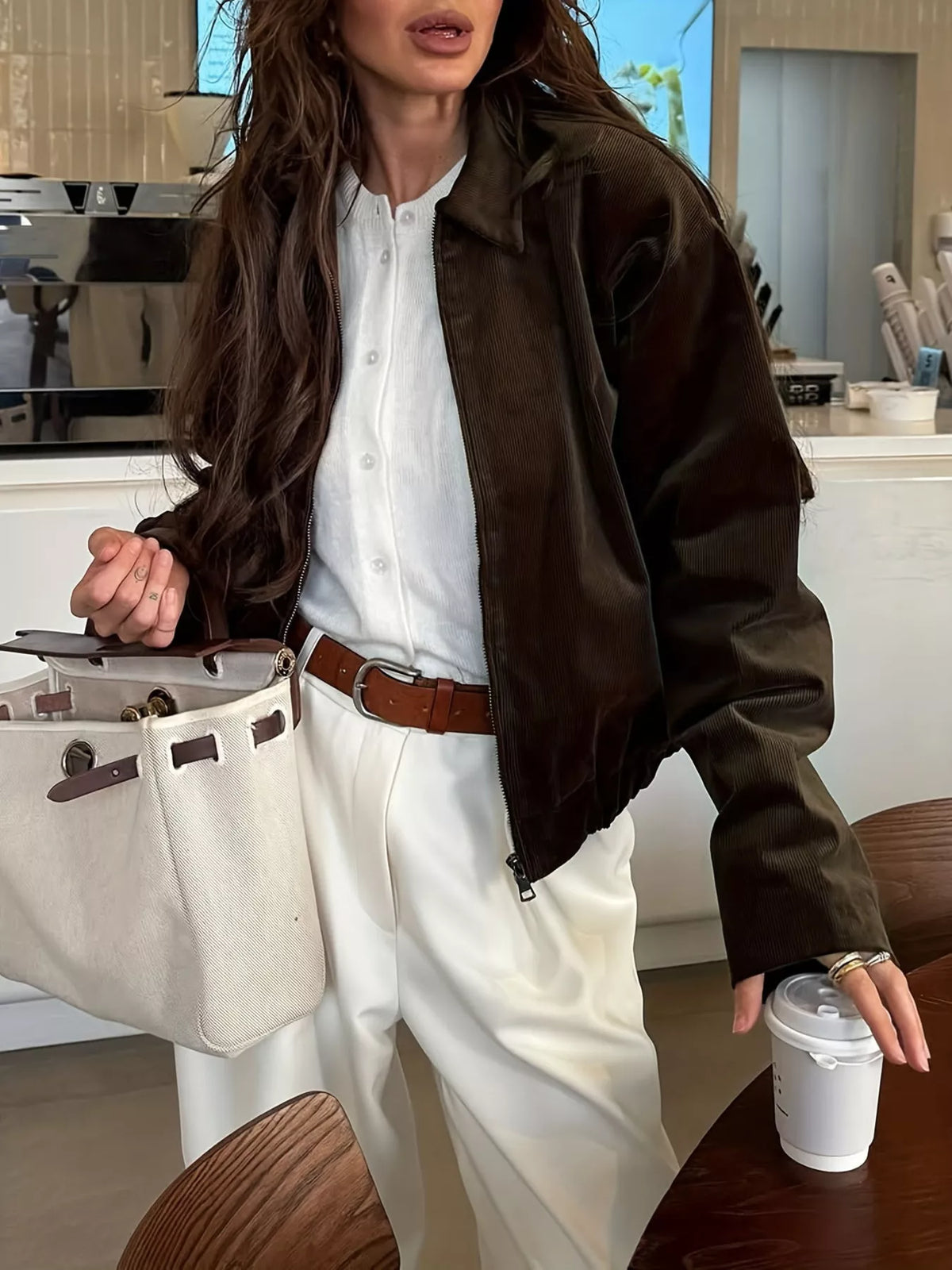 Brown corduroy zip-up jacket with relaxed fit, button front shirt underlay, collared style