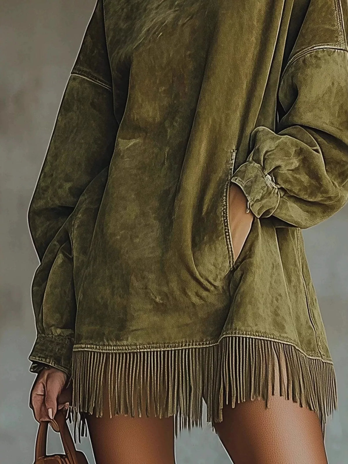 Olive green mock neck mini dress with long sleeves, draped cuff and fringe hem