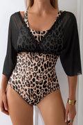 Leopard-print mesh V-neck swimsuit with black half sleeves, ruffle trim, close fit.