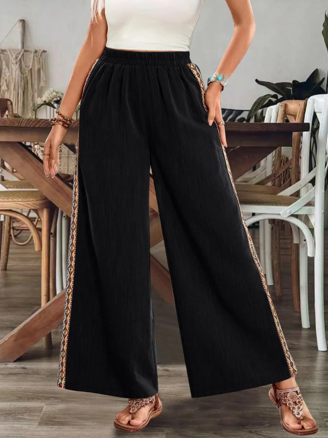 Black wide-leg pants with embroidered side stripe and elastic waistband