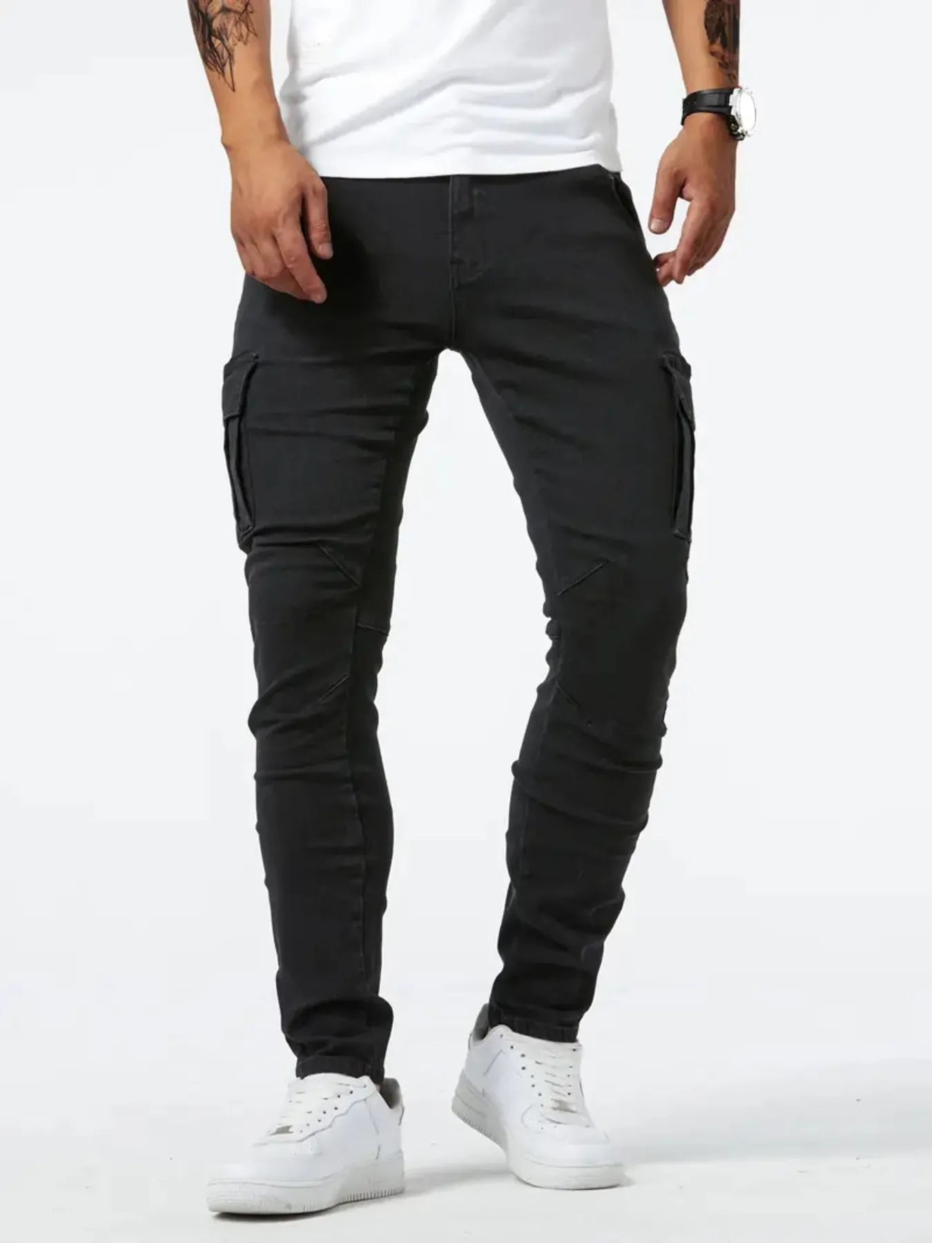 Black slim cargo jeans with side cargo pocket panels and stitched seams