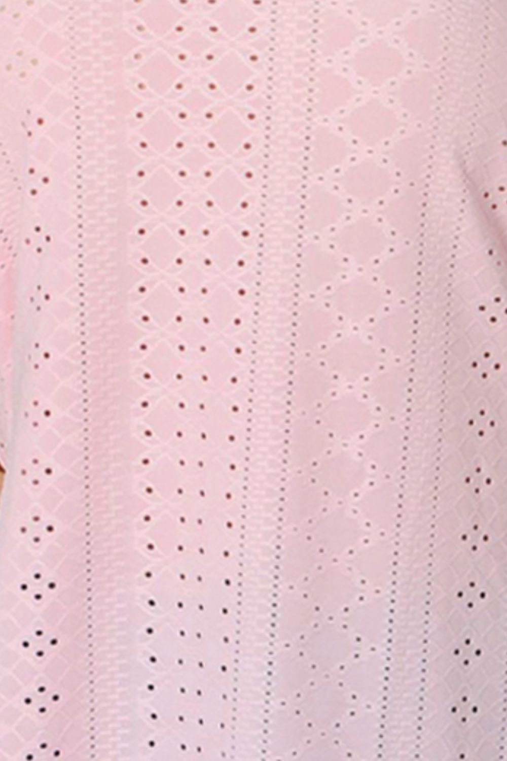Blush pink eyelet fabric with tiny punched motifs in vertical rows.