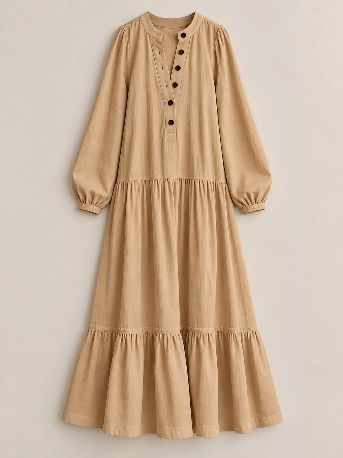 Light tan button-front tiered maxi dress with long puff sleeves, flat-lay front view