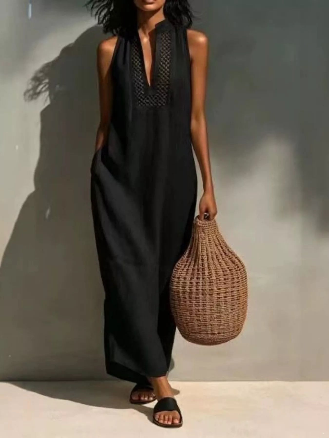 Black sleeveless maxi dress with V-neck embroidery and side pockets