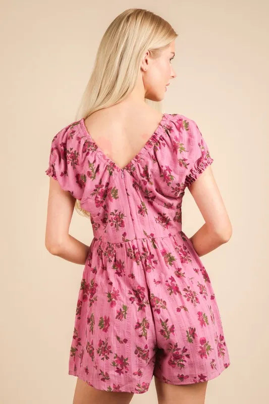 Pink floral ruffle romper with gathered waist and short back view, V-neck