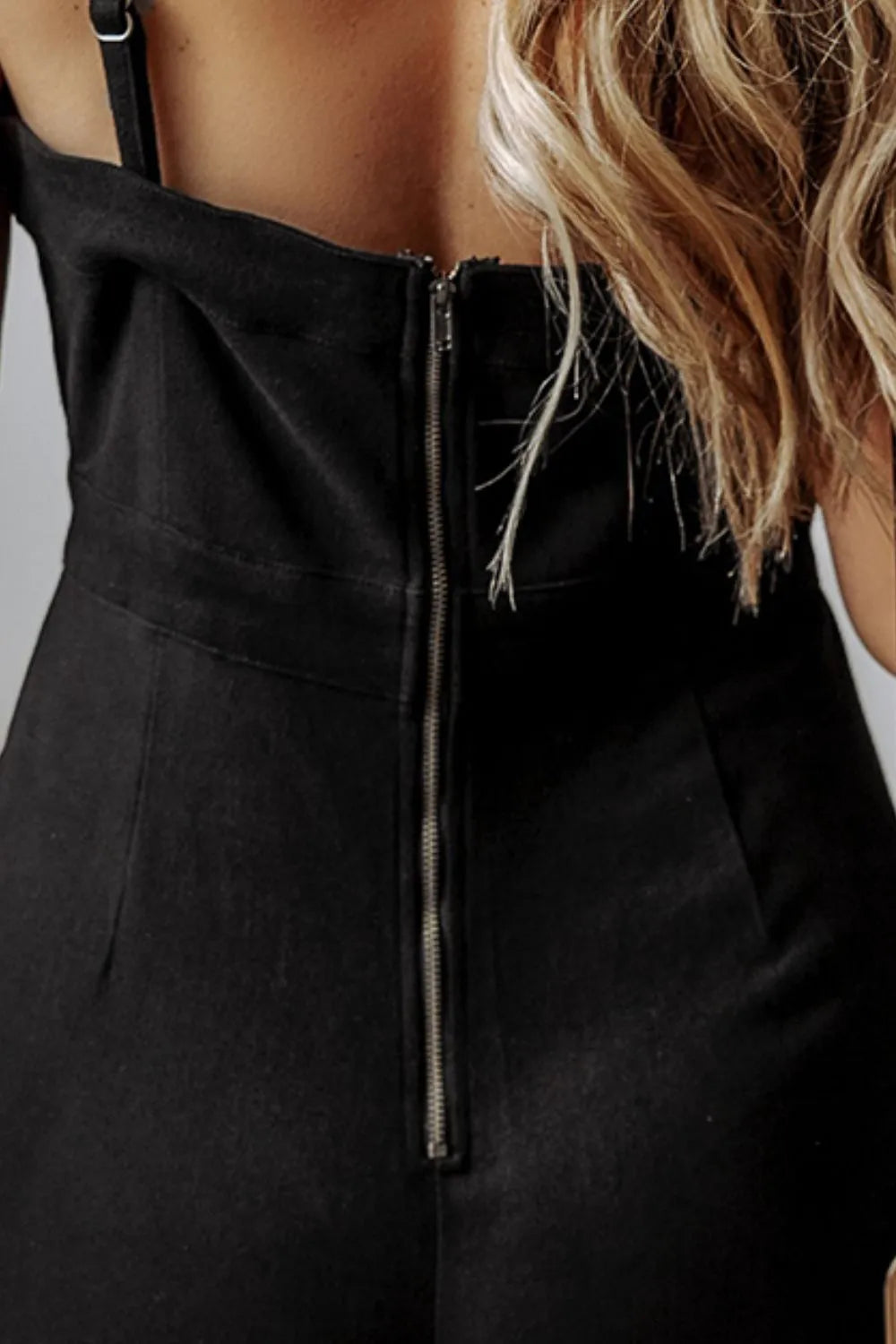 Black denim jumpsuit bodice with front center zipper and spaghetti strap