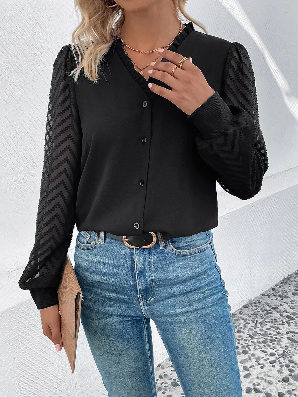 Black V-neck button-front blouse with sheer mesh sleeves and long cuffed cuffs