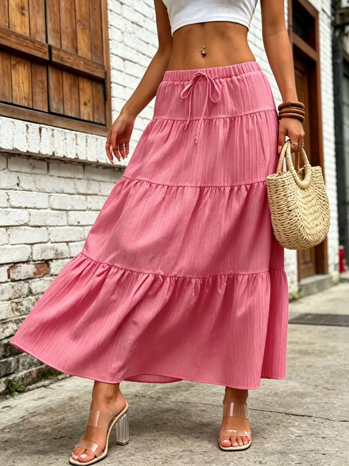 Pink tiered maxi skirt with ruched elastic waistband and drawstring bow