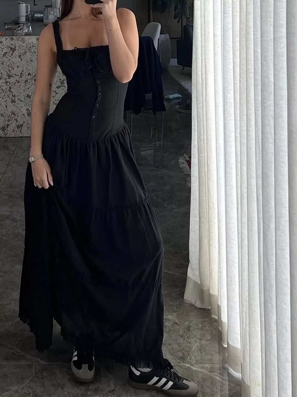 Black square-neck tiered maxi dress with gathered bodice and layered ruffle skirt