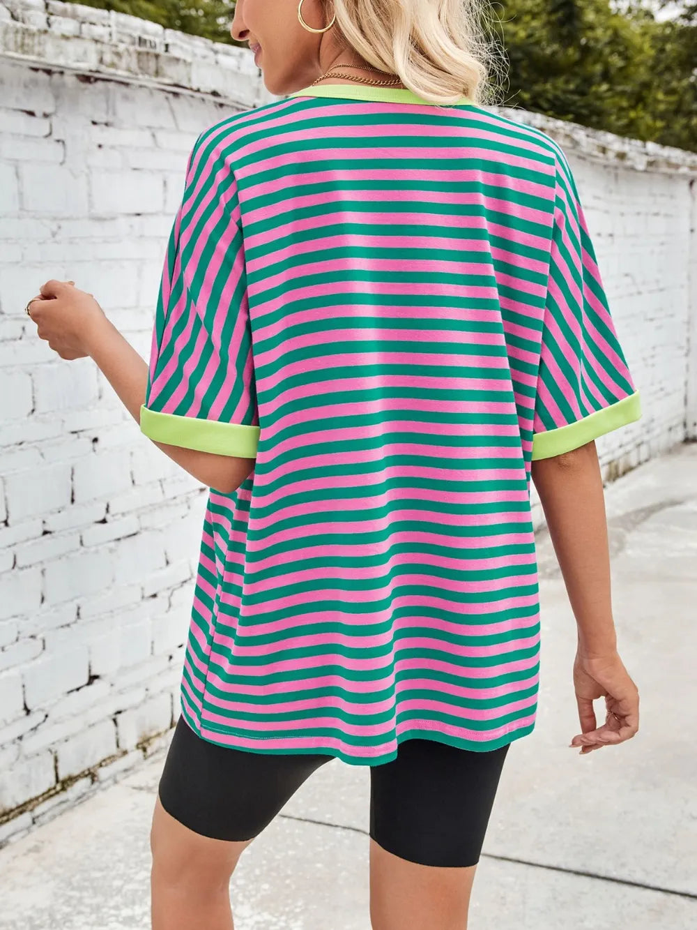 Back view of green and white striped round-neck half-sleeve T-shirt with yellow trim